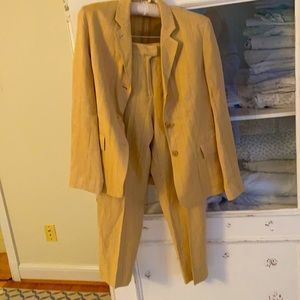 Silk/linen/cotton pinstripe jacket and trousers. Trousers are flat front.